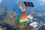 Ein Satellit fliegt über die Erde und scannt sie.
